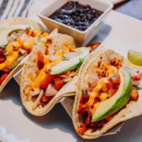 Marinated Grilled Chicken Tacos · Three corn or flour tortillas filled with grilled chicken, fresh pico de gallo, avocado, and...
