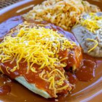 Tamale, Taco, & Beans Combo · Ground beef or shredded chicken with ranchera sauce, chile con queso, and white cheese.
