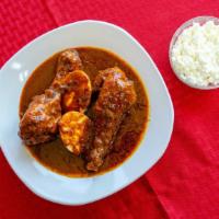 Doro Wot · Tender chicken leg marinated and simmered in seasoned butter and stewed in red pepper sauce,...