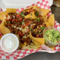 Nachos · Nacho cheese with pico of gallo, choose any meat, steak, chicken, chorizo. With sour cream a...