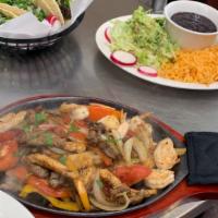 Fajitas · grilled chicken or steak with sautéed peppers and onion mix