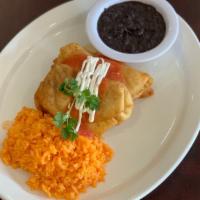 Chimichangas · Flour tortillas filled with chicken and veggies with side rice and bean.