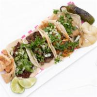 Tacos · Choice of meat, hand made corn tortilla, cilantro & onion
