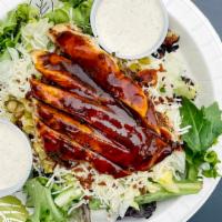 Southwest Chicken Salad · Chargrilled chicken breast brushed with chipotle BBQ sauce atop a bed of mixed greens, cucum...