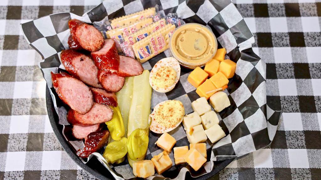 Cheese Plate · Sharp cheddar, pepper jack, smoked sausages, pickles, peppers, crackers and honey mustard