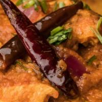 Spicy Chicken Vindaloo · Chicken dices marinated in Indian spices, oven baked, and slow cooked in hot chilli/tomato s...