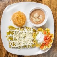 Enchiladas Verdes · Three enchiladas with your choice of chicken, ground beef or cheese covered with green tomat...