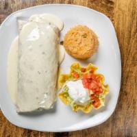 Burrito Gigante · Large flour tortilla filled with ground beef and beans, topped with cheese sauce. Served wit...