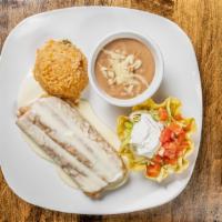 Chimichanga · Flour tortilla filled with ground beef or chicken, soft or fried with cheese sauce served wi...