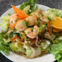 Yum Talay (Seafood) · Seafood thai salad of shrimp, squid, and scallops tossed with onions, lettuce, cucumber, cil...
