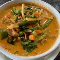 Gaeng Ped (Red Curry Duck) · Medium. Roasted duck cooked in our red curry with bamboo shoots, green beans, green peas, ca...