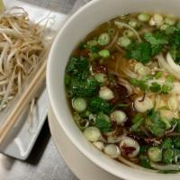 Pho · Home cooked soup with long, thin rice noodles, cilantro, green onions, white onions, shallot...