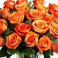 Dozen Orange Roses  · Brighten up someone's day with roses. Picked fresh from the farm, this arrangement is compos...