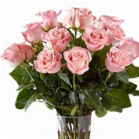 Dozen Pink Roses  · Enjoy the classic beauty of the rose with a playful twist in our Pink Rose Bouquet. This arr...