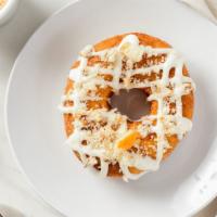 Cinnamon Crunch · A cinnamon tossed yeast donut with cream cheese drizzle and topped with cinnamon crumble.