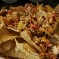 Cajun Chicken Nachos · Diced blackened chicken served over warm tortilla chips with assorted cheeses, and pico.