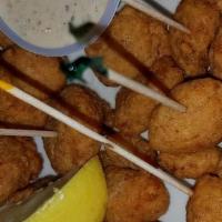 Catfish Beignets · Catfish nuggets marinated in Louisiana hot sauce and lightly deep fried, served with remoula...