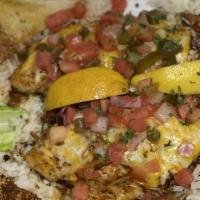 Catfish A La Roy · Two catfish filets blackened, grilled or fried topped with cheese and pico De gallo served o...