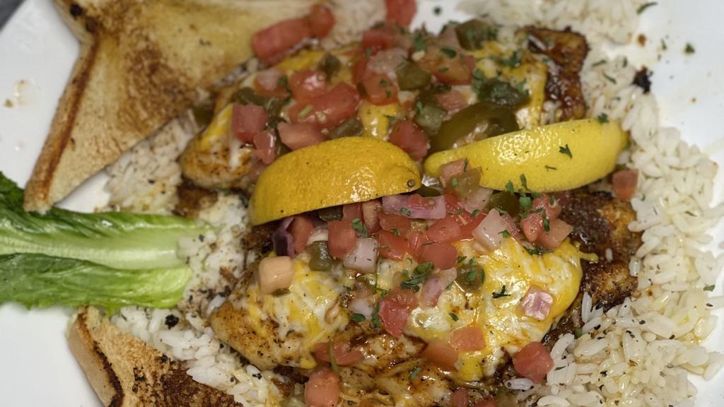 Catfish A La Roy · Two catfish filets blackened, grilled or fried topped with cheese and pico De gallo served over rice with Texas toast.
