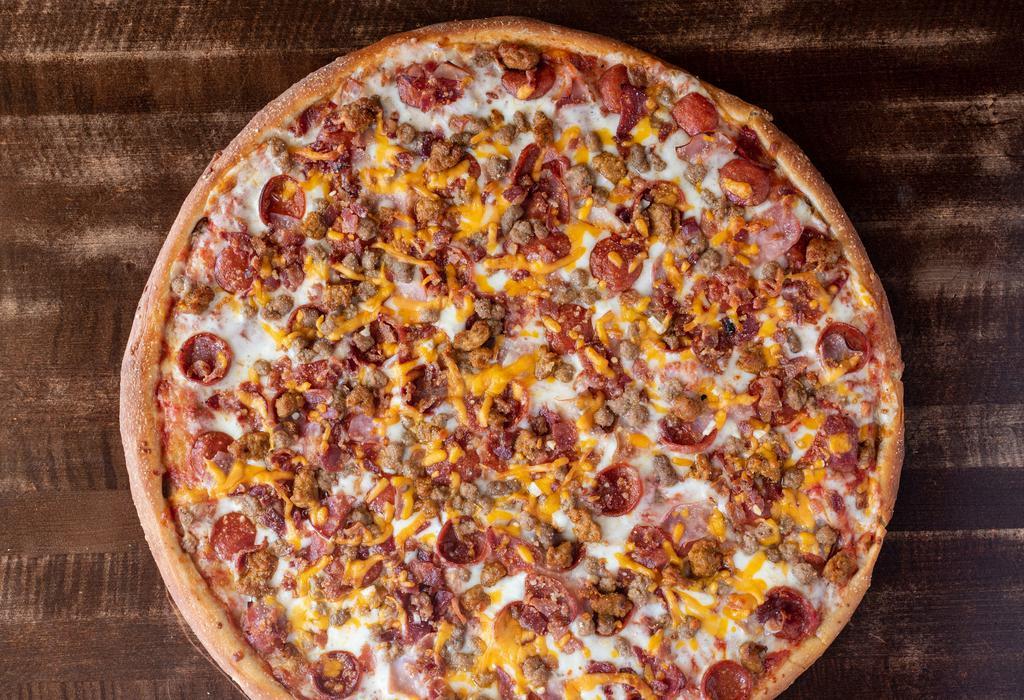 Meat Lovers · Pepperoni, ham, capicola, sausage, ground beef and bacon on top of a three cheese mix of mozzarella, cheddar and romano with pizza sauce.