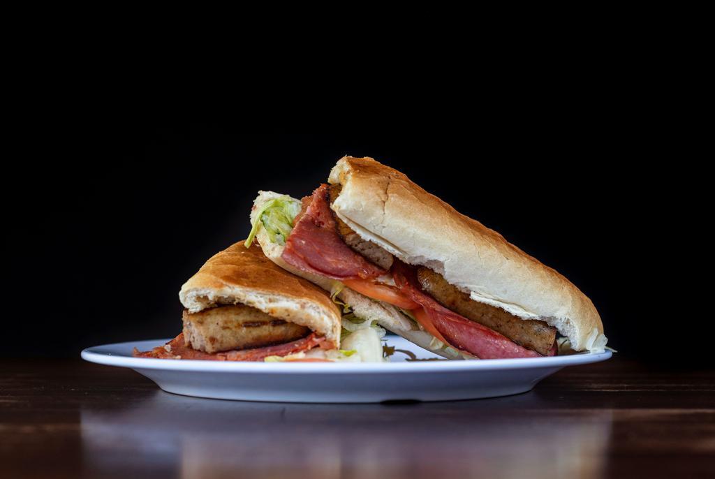 The Royal · Sausage, capicola, salami, lettuce, tomato and baked with melted cheese.