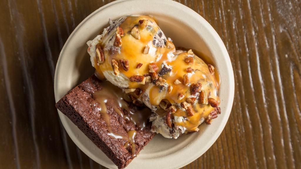 Bourbon Brownie Sundae · Bourbon pecan fudge ice cream, house made brownie, topped with roasted pecans and made from scratch bourbon caramel sauce.