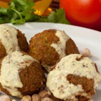 Falafel · Deep fried patty made with fave beans, g garbanzo beans, parsley, and spices.