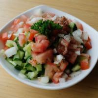 Shirazi Salad · Mixture of diced cucumbers, red onions, tomato, olive oil, and fresh lemon juice.