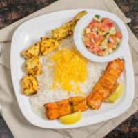 Salah'S Special · A skewer of grilled chicken kabob and a skewer of salmon kabob with white rice and shirazi s...
