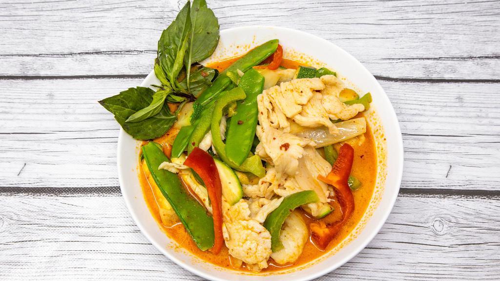 Red Curry · Spicy. Shredded red and green pepper, onion, snow peas and zucchini sautéed in a red coconut curry sauce.