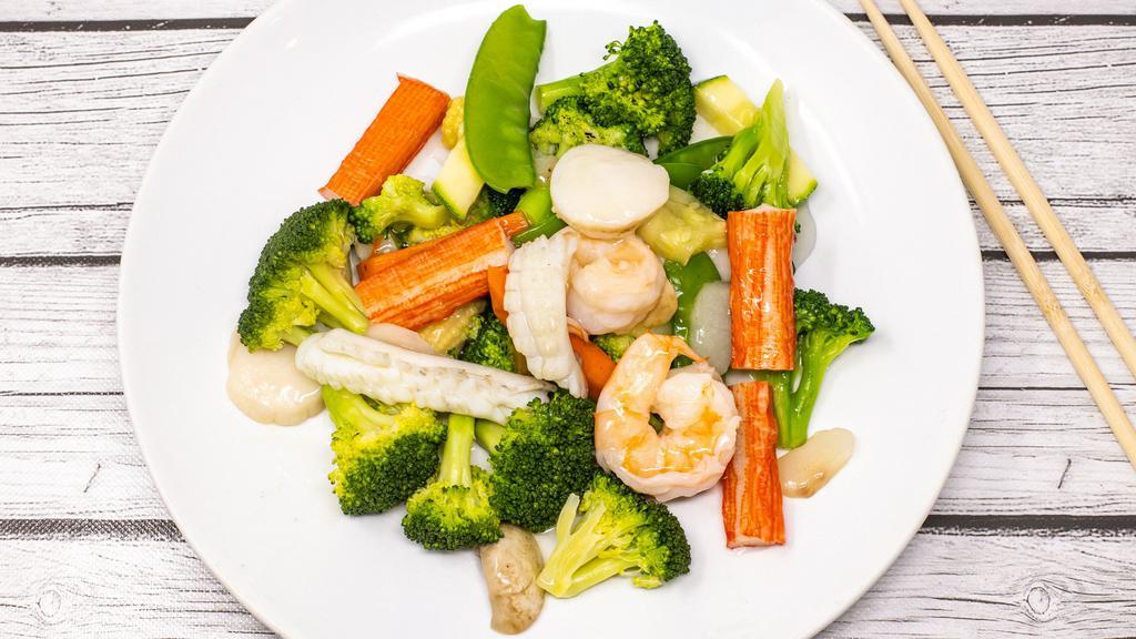 Seafood Delight · Scallop, shrimp, squid and crab meat with mixed vegetables in white sauce.
