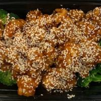 Sesame Chicken 芝麻鸡 · Hot and spicy. served with white rice.