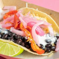 Stoner Taco · Mexican rice, black beans, pickled onion-habanero salsa, queso fundido.