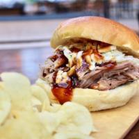 Pulled Pork Sandwich  · 12 hours smoked Pork Butt tossed in our homemade BBQ sauce, with coleslaw, all on a brioche ...
