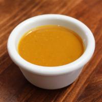 Carolina Mustard · Golden mustard BBQ sauce balanced with honey and brown sugar.  Perfectly rich and tangy.