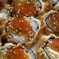 Salmon Roe Sushi · Seaweed wrapped around rice and filling.