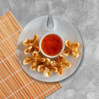 Crab Rangoon Project · Golden fried wontons stuffed with cream cheese and crab meat. Served with sweet and sour sau...