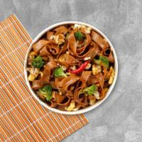 Pad Kee Mow · Wide rice noodles sauteed with mixed vegetables and basil with chili sauce.