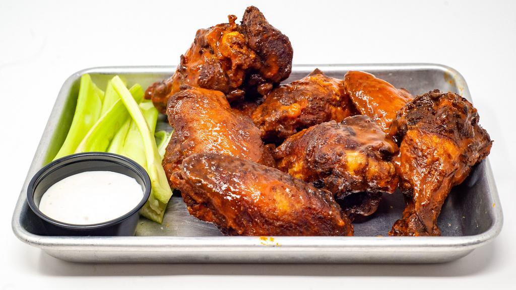 Slider House Wings · Eight jumbo wings tossed in your choice of housemade sauce, bloody Mary, sriracha honey, buffalo or dry rub.