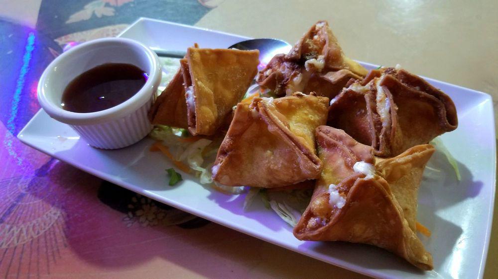 Crab Delight · Deep-fried wonton filled with crab meat, and cream cheese. Severed with sweet and sour sauce.