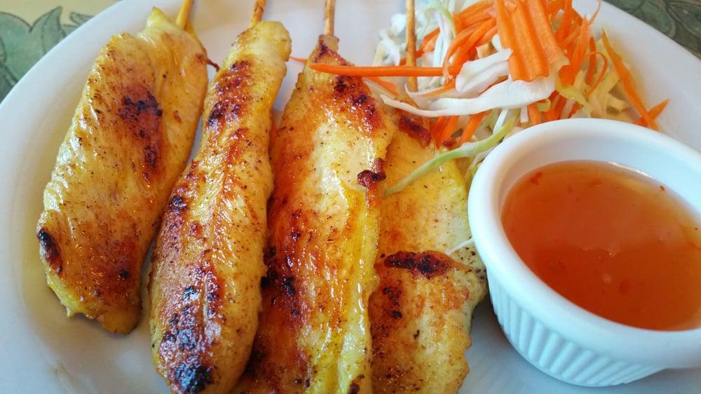 Satay Chicken · Chicken breast slices marinated in a house sauce grilled on a bamboo skewer. Served with peanut sauce and sweet chili sauce.