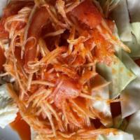 Som Tum (Papaya Salad) · Papaya salad. A popular sliced green papaya and carrots tossed with tomatoes, grounded garli...
