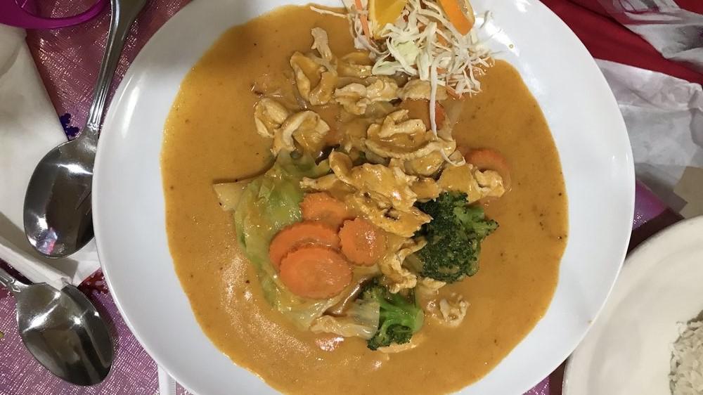 Green Curry · A thai green curry cooked with bell peppers, onions, mushrooms, baby corn, bamboo shoots, carrots, broccoli, zucchini, and thai basil leaves. Coconut milk base and gluten-free.
