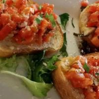 Bruschetta Al Pomodoro · Italian Bread Sliced Thin, Toasted & Topped With Our Special Blend Of Tomatoes, Seasoning & ...