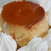 Dulce De Leche Cheesecake · Rich creamy cheesecake swirled with caramel in a graham cracker crust. Topped with caramel m...