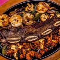 Fajita Guadalajara · Grilled chicken, steak, shrimp, baby ribs, and chorizo.
