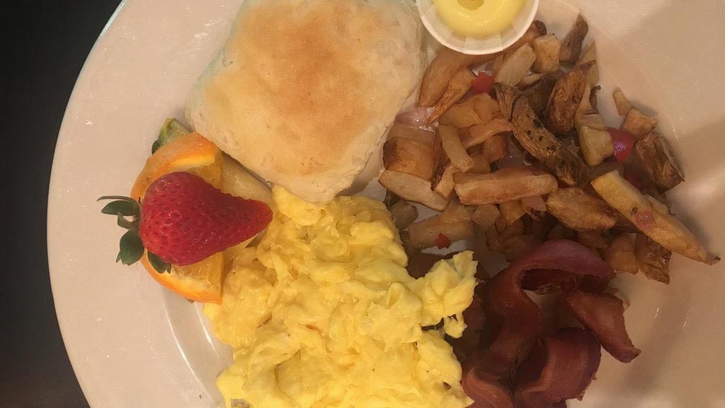 Country Breakfast · Two eggs cooked to order, choice of breakfast potatoes or cheese grits, choice of bread. Add breakfast meat for an additional charge.