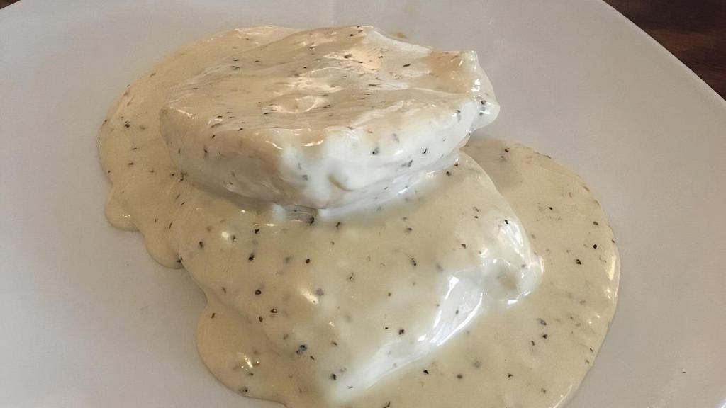 Biscuit & Gravy · Homemade buttermilk biscuit served with creamy white gravy. Add crumbled sausage for an additional charge.