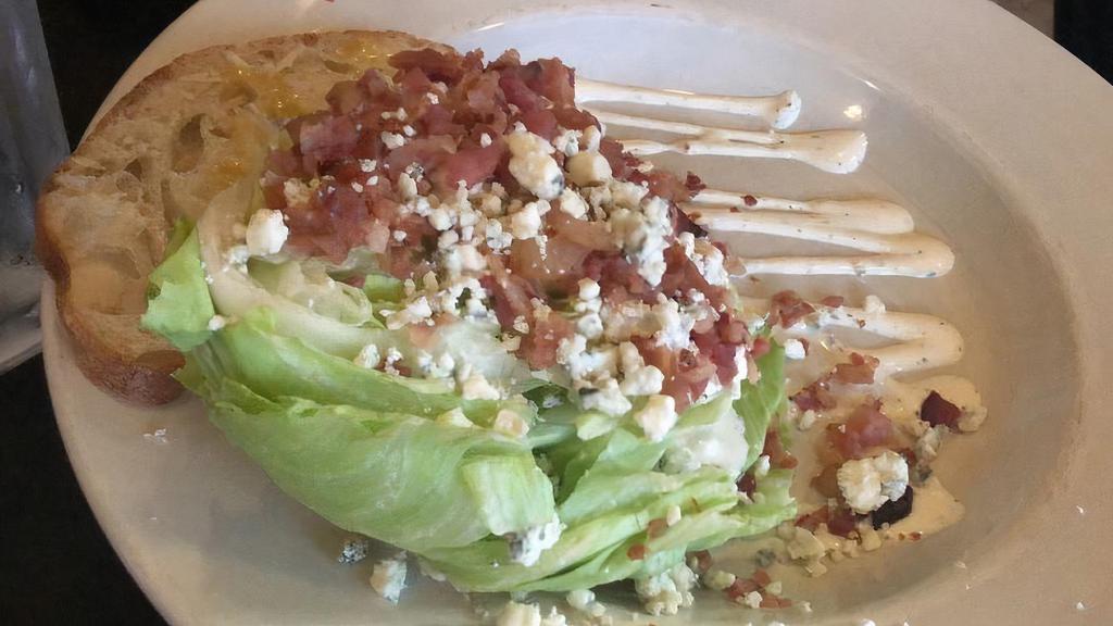 The Wedge · Baby Iceberg lettuce with creamy crumbled blue cheese and Petit Jean bacon. Add three fried chicken livers or oysters for an additional charge.