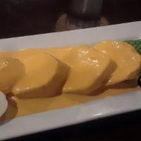 Papa A La Huancaina · Boiled potato slices topped with a traditional savory Peruvian cheese sauce.